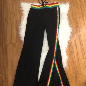Black track pants with rainbow sides with snaps